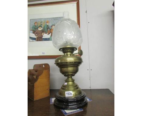 A Victorian oil lamp with etched shade,