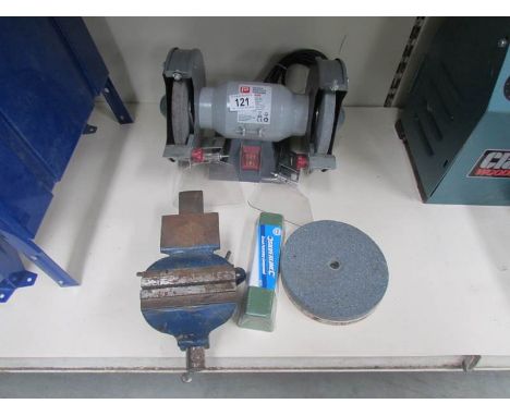 A PP150Bg Performance power grinder, spare grinding discs and a small bench vice.