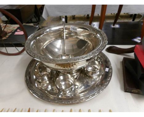 A silver plate punch bowl with 6 cups, ladle and tray.a