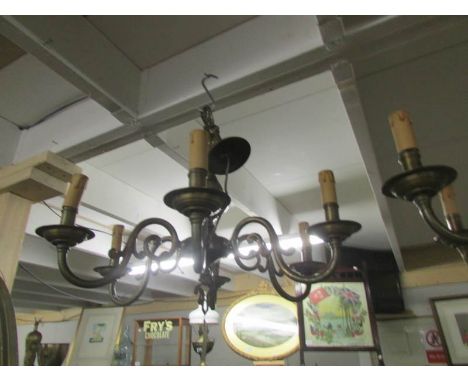A 5 lamp brass ceiling light.