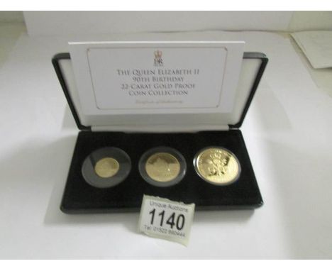 The Queen Elizabeth II 90th birthday 22ct gold proof coin collection, £5, £2, £1.