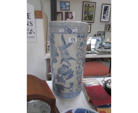 A blue and white stick stand.