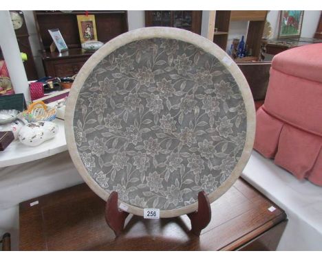 A large ceramic charger.
