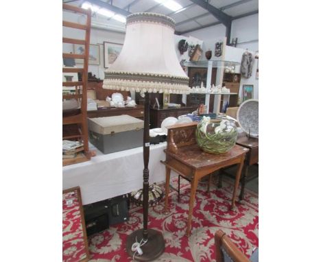 A standard lamp with shade.