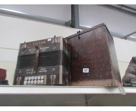 An old Vulkan  accordion in wooden case.