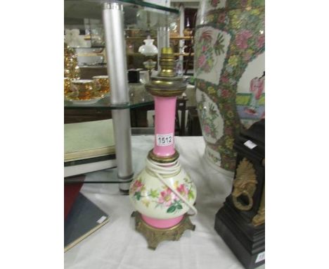 A metal and ceramic table lamp base.