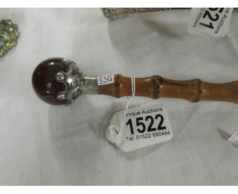 A ladies walking stick with silver and Scottish agate top.