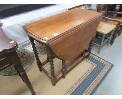 A barley twist oak gate leg table.