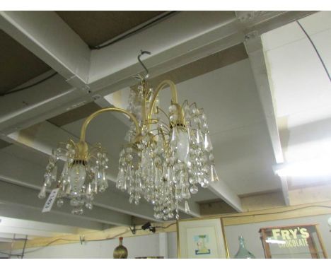 A 3 lamp chandelier.