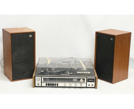 A vintage Sanyo G2711-Super music record cassette player with a pair of teak Wharfedale speakers. 