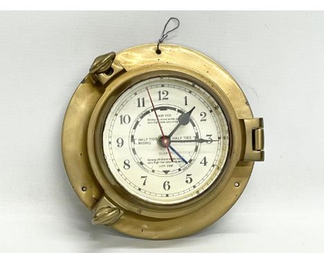 A brass ships clock. 19cm 