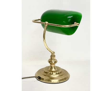 A brass desk lamp with glass shade. 28x35cm. 