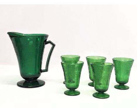 A vintage drinking set. Jug measures 19cm 