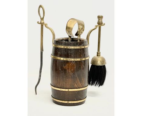 A vintage oak brass bound companion set. 