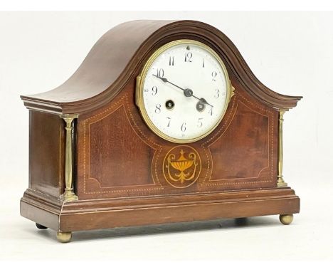 An Edwardian inlaid mahogany mantle clock. With key and pendulum. 30x12x23cm 