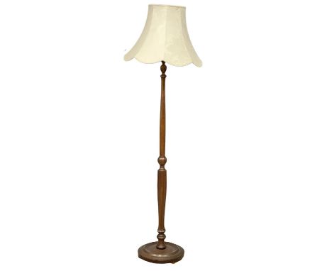 A vintage mahogany standard lamp. 175cm 