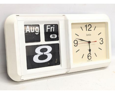 A vintage Acctim wall calender clock. 48x25.5cm 