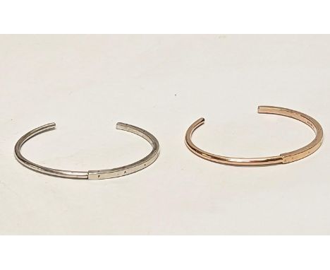 A silver bangle with other bangle. 