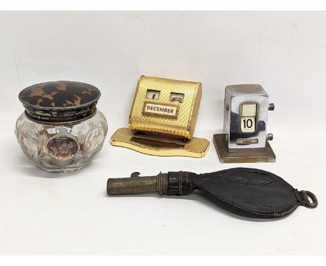 A sundry lot including an Art Deco desktop calender and other, a silver and faux tortoise shell powder pot, and a 19th centur