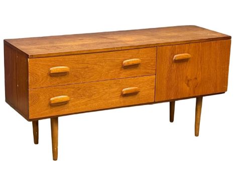 A Mid Century teak compact sideboard. 119.5x38x59cm 