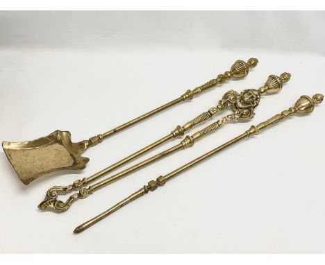 3 good quality Victorian heavy brass fire tools and a pair of vintage brass andirons. Tools measures 79cm 