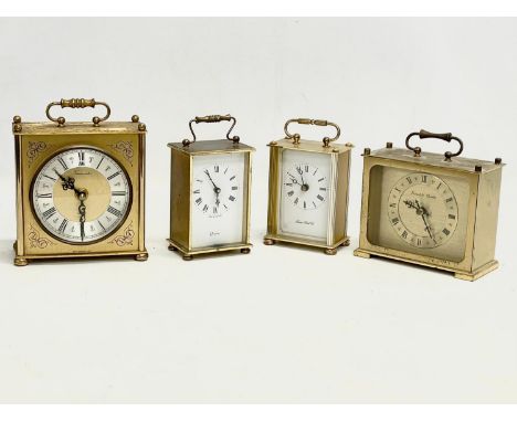 4 vintage brass clocks. Largest 13x7x16cm 