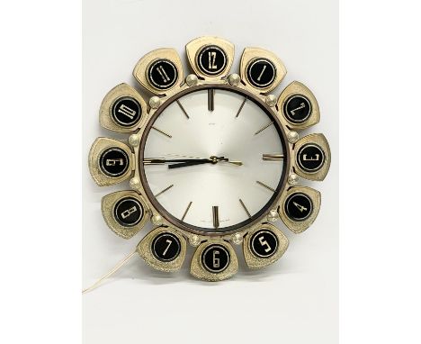 A 1960’s Mid Century sunburst wall clock by Metamec. 34cm 