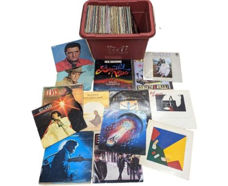 A collection of vintage vinyl LP records including Elton John, Elvis, The Carpenters, Johnny Cash, etc. 