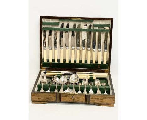 A vintage canteen of silver plated and steel cutlery. 39x30x8cm 