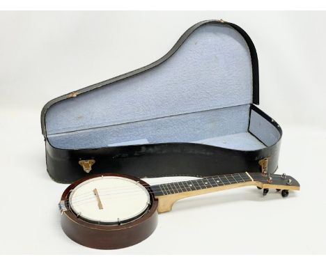 A vintage Ukulele Banjo in case. 59cm 