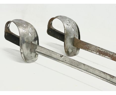A pair of late 19th/early 20th century Wilkinson made swords. Stamped WD (War Department) 102cm. 