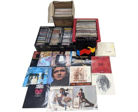 A collection of vintage vinyl records and LPs, with a collection of CDs. Including Michael Jackson, Johnny Cash, ABBA, Neil D
