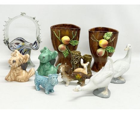 A sundry lot of pottery. Including 4 Sylvac animals, a pair of Italian vases 15cm, 2 Nao swans etc 