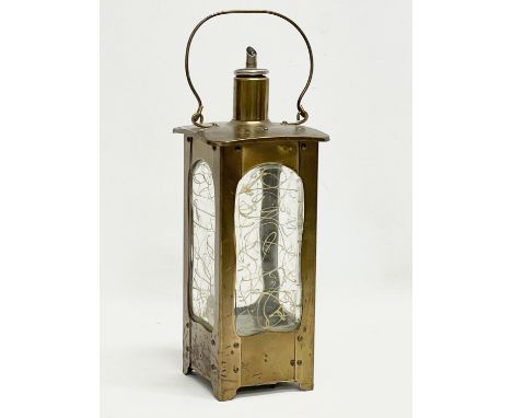 A vintage brass musical decanter. 11x28cm 