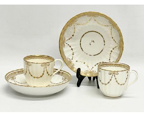 A pair of early 19th century Crown Derby porcelain cups and saucers. 