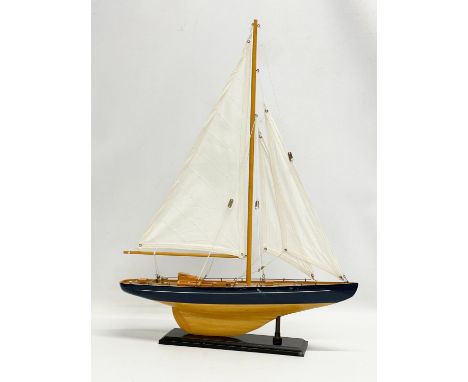 A wooden model yacht. 42x55.5cm 