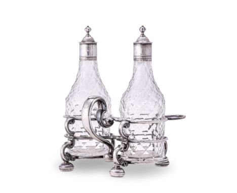 A GEORGE I SILVER TWO-BOTTLE CRUET STAND, SIMON PANTIN, LONDON, 1724 the hour-glass shaped stand with two double ring bottle 
