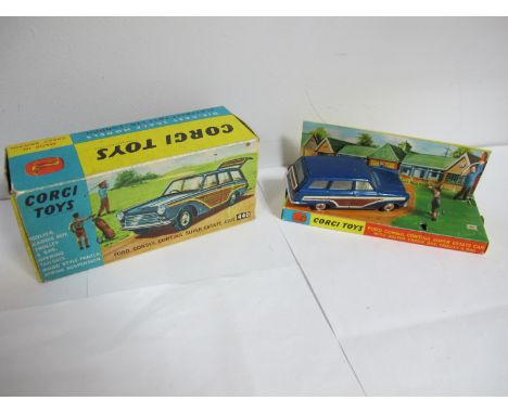 A Boxed Original Corgi #440 Ford Consul Cortina Super Estate Car, metallic blue body, cream interior, 'woody' panels, spun hu