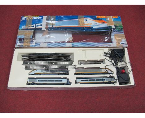 A Hornby "HO" Scale Eurostar Train Set. Made up of a power car, dummy and two coaches. Playworn- some minor parts missing. Bo