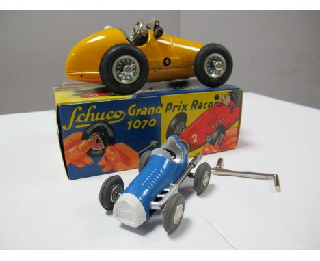 A Post War Boxed Schuco Grand Prix Racer No. 1070, in yellow. Although base stamped US Zone Germany, box printed Western Germ