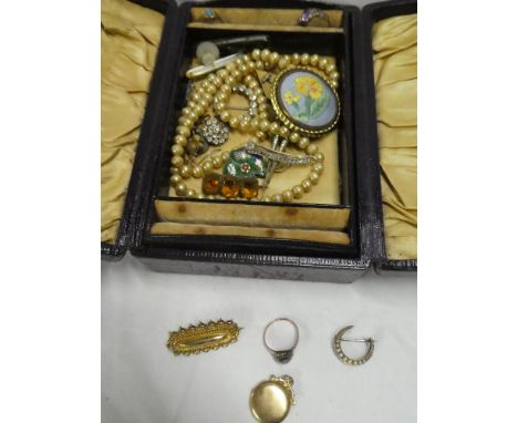 A jewellery box containing a selection of various jewellery including 9ct gold bar brooch, 9ct circular locket pendant, 9ct d