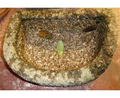 A Cornish granite D-shaped garden trough, 21" x 14"