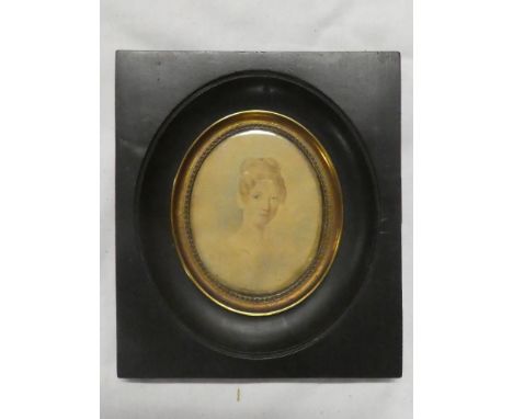 A 19th Century miniature watercolour on paper depicting a bust portrait of a female "Madame Lecrosnier" 3" x 2½" oval in ebon