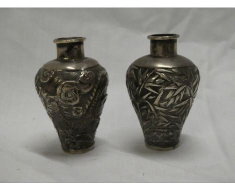 A pair of Chinese silver miniature tapered vases with raised dragon and floral decoration, signed, 1¾" high