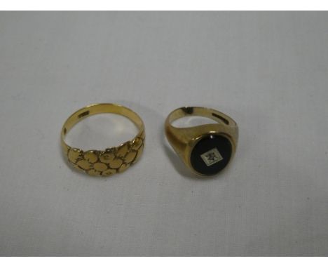 An 18ct gold engagement ring with floral decoration and a 9ct gold signet-style ring with inset black oval panel and single d