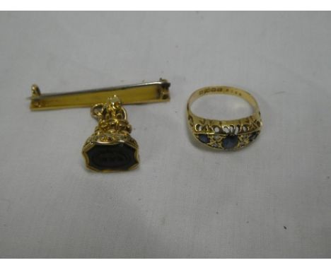 A Victorian 18ct gold dress ring set three sapphires and four small diamonds and a 19th Century fob seal