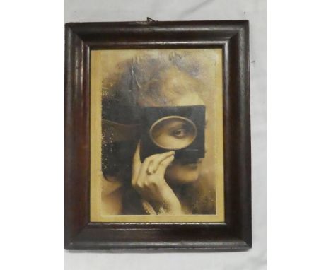 An old photographic print of a female holding a frame to her face