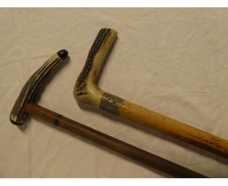 A gentleman's silver mounted malucca walking stick with antler handle and one other antler mounted walking stick (2)