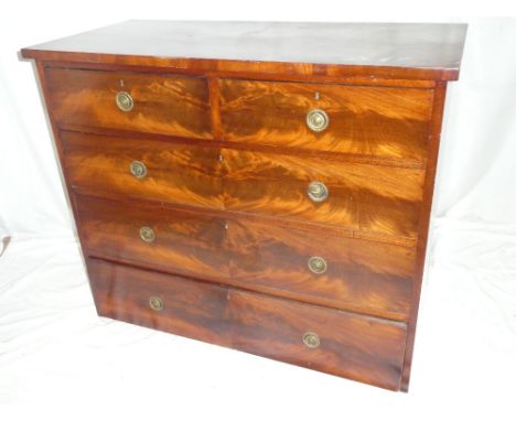 A Victorian figured mahogany chest of two short and three long drawers with brass ring handles (minus feet)
