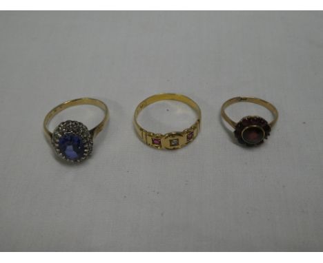 A Victorian gold dress ring set a diamond flanked by two rubies, 9ct gold dress ring set a sapphire surrounded by diamond chi